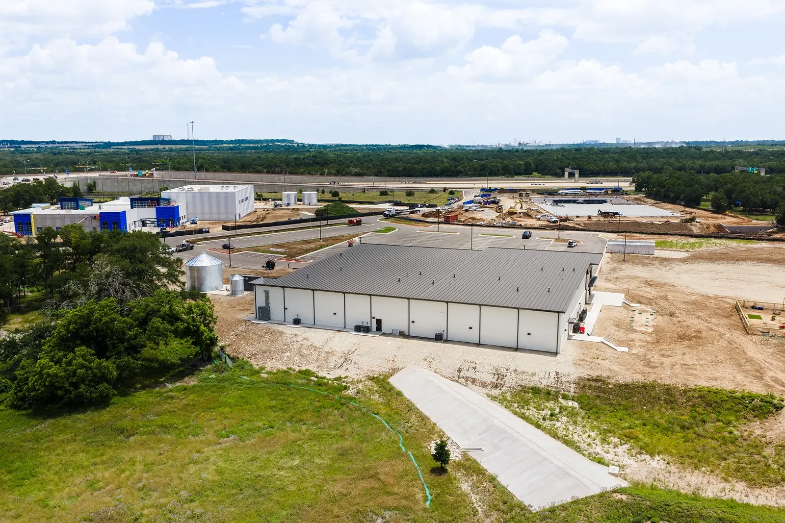 Aerial of a commercial campus with site work under way