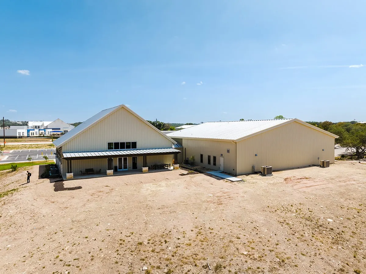 New church building beside a graded lot