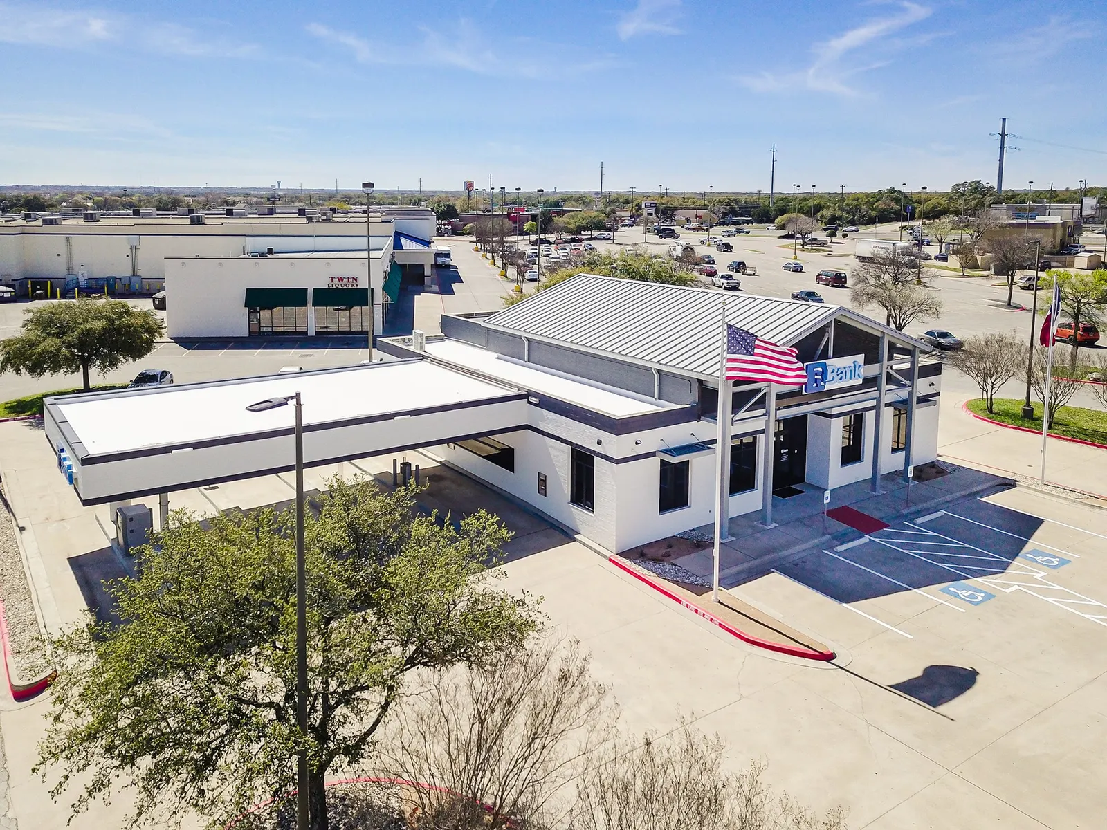 Aerial of a new bank branch with drive-through and parking