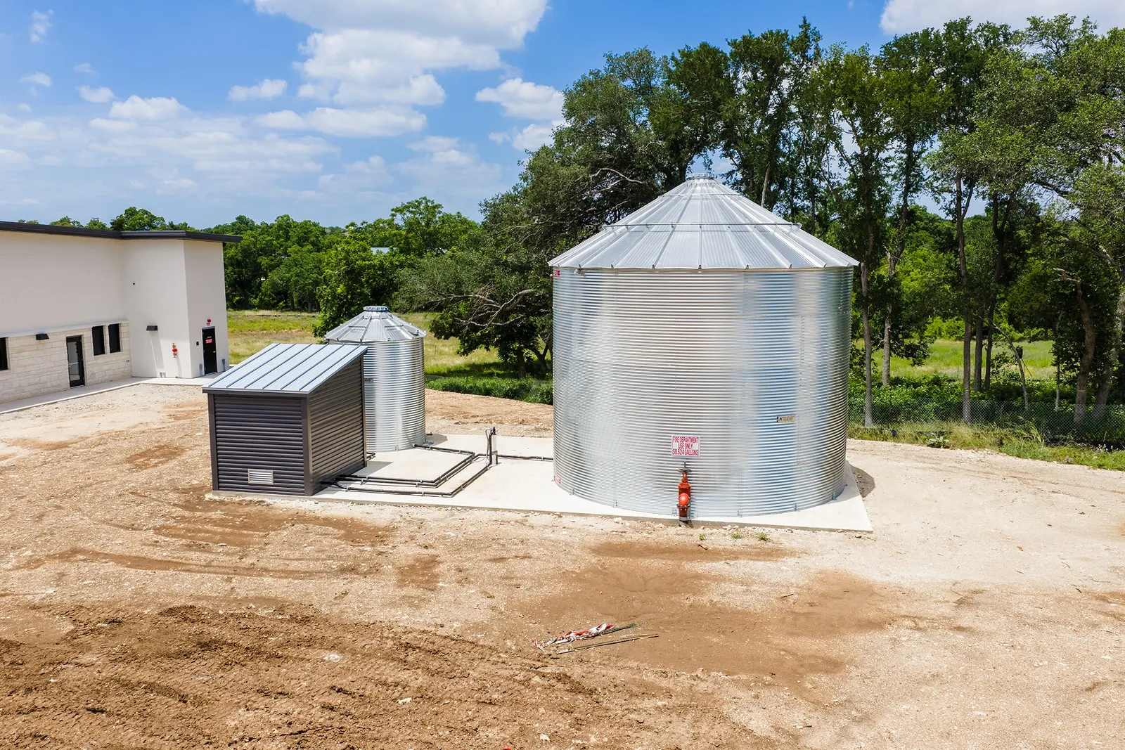 Site utility tanks on a new pad at an Aday & Associates project