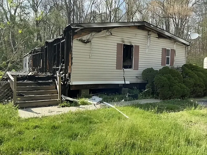Fire-damaged mobile home before demolition by R&G Land Clearing