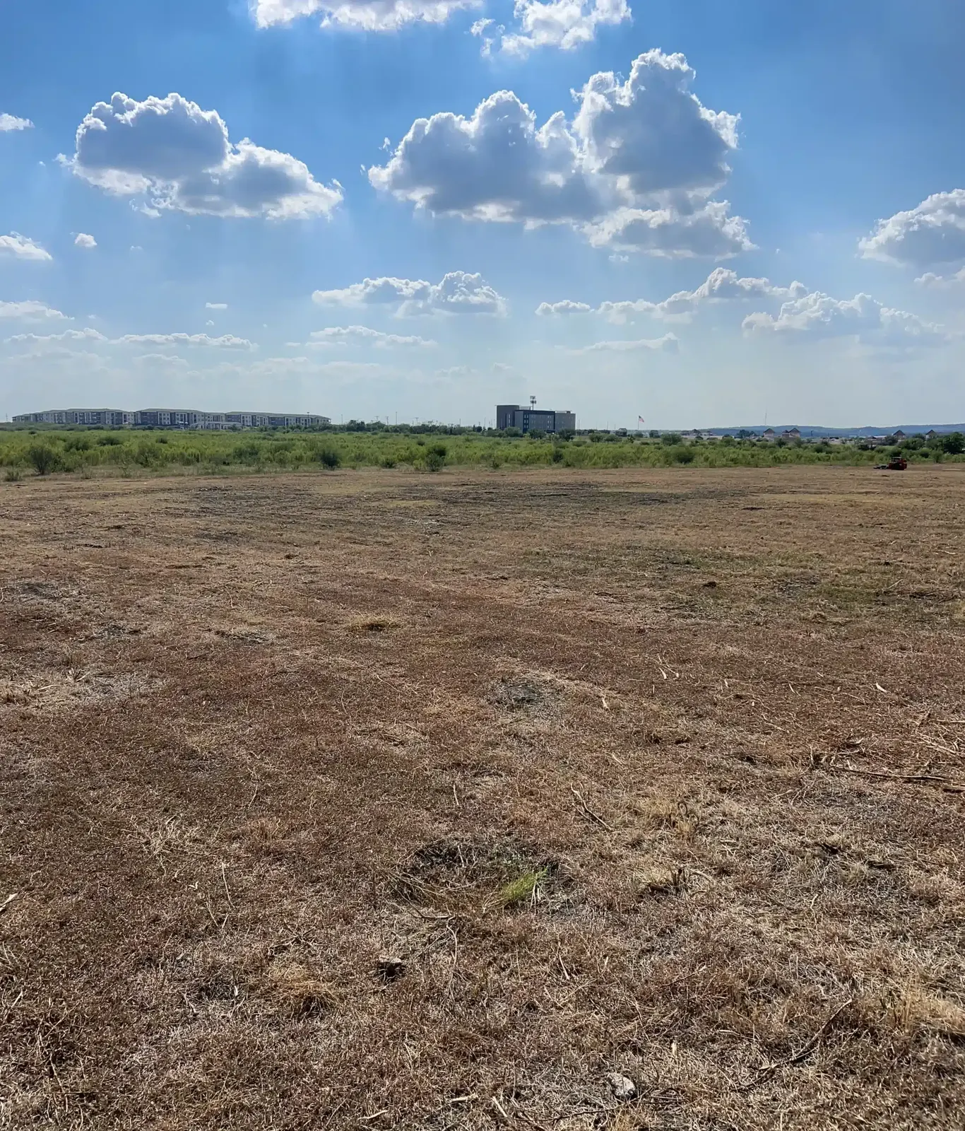 Open field cleared and ready for site work in Central Texas